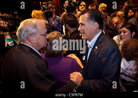 Gov. Mitt Romney greets supporters during a brief stop September 12 ...