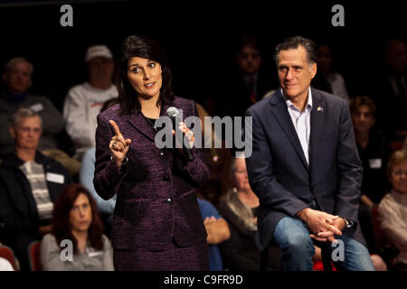 Republican presidential candidate Gov. Mitt Romney with Gov. Nikki Haley during a town hall meeting on December 17, 2011 in Charleston, South Carolina. Romney is in South Carolina following the endorsement of Tea Party favorite Gov. Nikki Haley. Stock Photo