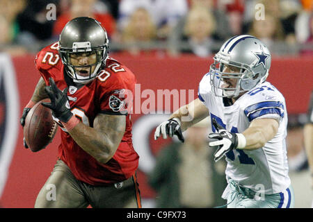 Dallas Cowboys middle linebacker Keith Brooking (51) and Dallas Cowboys  cornerback Orlando Scandrick (32) bring down Tampa Bay Buccaneers tight end  Zack Pianalto (80). The Cowboys defeated the Buccaneers 31-15 in an