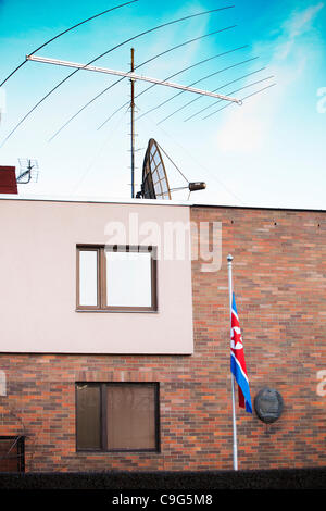 Half-staff flag of Democratic People's Republic of Korea hangs at the DPRK Embassy in Prague, Czech Republic, on Dec. 12, 2011. (CTK Photo/Martin Sterba) Stock Photo