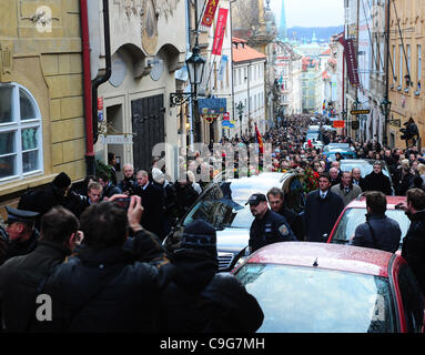 People follow funeral car with remains of Vaclav Havel, the first president of Czech Republic and the last president of Czechoslovakia in Prague on Wednesday, Dec. 21, 2011. Havel's coffin will be displayed at Prague Castle until funeral ceremony on Friday. (CTK Photo/Stanislav Peska) Stock Photo