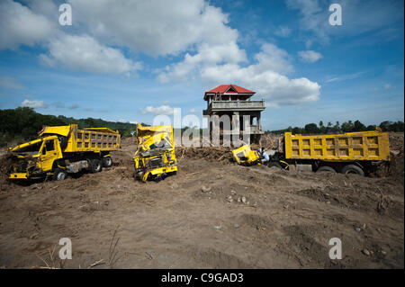 CAGAYAN DE ORO, PHILIPPINES, 22/12/2011. Trucks destroyed by flooding in Cagayan De Oro. Typhoon Washi in the Philippines has killed more than 1000 people, and leave  tens of thousands homeless. Stock Photo