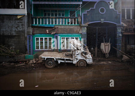 CAGAYAN DE ORO, PHILIPPINES, 22/12/2011. A car damaged during flooding in Cagayan De Oro. Typhoon Washi in the Philippines has killed more than 1000 people, and leave  tens of thousands homeless. Stock Photo