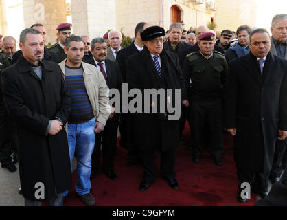 Dec. 24, 2011 - Ramallah, West Bank, Palestinian Territory - Palestinian President, Mahmoud Abbas (Abu Mazen), lays a wreath of flowers on the body of the late fighter Mustafa al-Maliki former governor of Qalqilya presidential headquarters in  the west bank city of Ramallah, on Dec. 24, 2011. Photo  Stock Photo