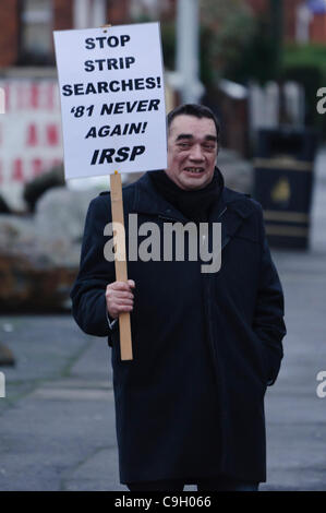 Belfast, Northern Ireland - 31/12/2011: Paul Little from the Irish Republican Socialist Party (former political wing of the INLA) at a vigil for Irish Republican Prisoners in Maghaberry Prison, holding a poster saying 'Stop Strip Searches! '81 never again! IRSP' Stock Photo