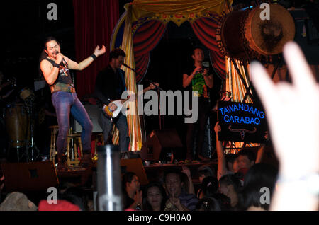 the new year is brought in with Carabao music (Thailand's well known folk / rock band), being performed by a cover band. Tawandang German brewery, Rama 3 Road, Bangkok, Thailand. credit: Kraig Lieb Stock Photo