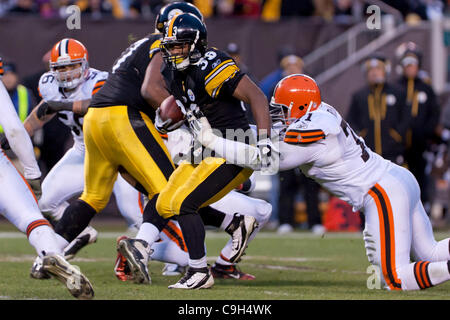 Jan. 1, 2012 - Cleveland, Ohio, U.S - Pittsburgh running back Isaac Redman (33) is in the grasp of Cleveland defensive tackle Ahtyba Rubin (71) during the second quarter.  The Pittsburgh Steelers defeated the Cleveland Browns 13-9 in the game played at Cleveland Browns Stadium in Cleveland, Ohio. (C Stock Photo