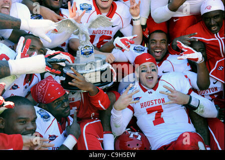 Jan. 2, 2012 - Dallas, Texas, United States of America - Houston Cougars quarterback Case Keenum (7) and his team celebrate with the TicketCity trophy during the post game celebration as the #19 Houston Cougars defeat the #22 Penn State Nittany Lions 30-14 in the 2012 TicketCity Bowl at the Cotton B Stock Photo