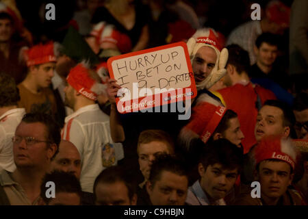 02.01.2012 London,  Fans with signs at the final of The Ladbrokes.com PDC World Darts Championship held at Alexandra Palace. Stock Photo