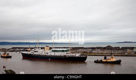 Edinburgh, UK. 6th Jan, 2012. The Royal Yacht Britannia being moved to dry dock in Leith, Edinburgh. The ship had to have water pumped after a door leak while being prepared for the move to Dry Dock. Stock Photo