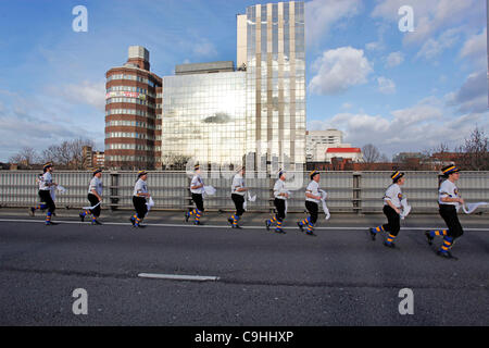Hammersmith Morris side celebrate 50th anniversary of the dance Hammersmith Flyover, written for them in 1962 by John Kirkpatrick, by dancing across the Hammersmith Flyover, London. The flyover, which inspired the song, is currently closed for investigations and repairs. 7th Jan, 2012. Stock Photo