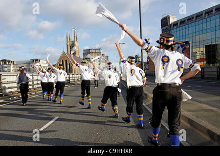 Hammersmith Morris side celebrate 50th anniversary of the dance Hammersmith Flyover, written for them in 1962 by John Kirkpatrick, by dancing across the Hammersmith Flyover, London. The flyover, which inspired the song, is currently closed for investigations and repairs. 7th Jan, 2012. Stock Photo
