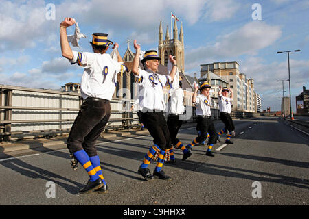 Hammersmith Morris side celebrate 50th anniversary of the dance Hammersmith Flyover, written for them in 1962 by John Kirkpatrick, by dancing across the Hammersmith Flyover, London. The flyover, which inspired the song, is currently closed for investigations and repairs. 7th Jan, 2012. Stock Photo