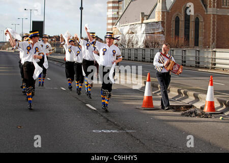 Hammersmith Morris side celebrate 50th anniversary of the dance Hammersmith Flyover, written for them in 1962 by John Kirkpatrick, by dancing across the Hammersmith Flyover, London. The flyover, which inspired the song, is currently closed for investigations and repairs. 7th Jan, 2012. Stock Photo