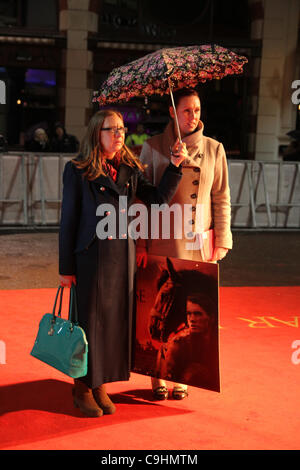 Two women stand on the red carpet at the London premiere of the movie War Horse. Stock Photo