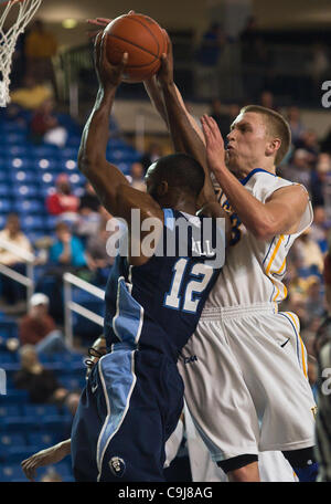 Jan. 11, 2012 - Newark, Delaware, United States of America - 01/11/12 Newark DE: Old Dominion Sophomore Guard Donte Hill #12 attempts a lay up, however Delaware Freshman Guard #13 Kyle Anderson (Right) blocks the lay up attempt on defense during a Colonial Athletic Association conference Basketball  Stock Photo