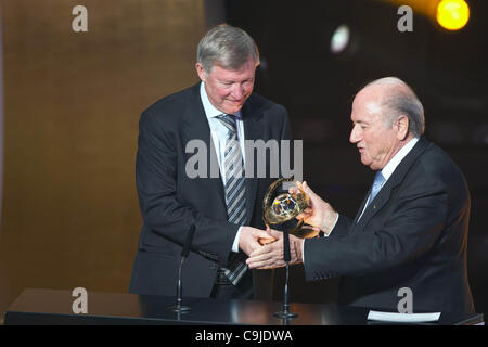 (L-R) Sir Alex Ferguson, Joseph Blatter, JANUARY 9, 2012 - Football / Soccer : Sir Alex Ferguson receives the FIFA Presidential Award trophy from Joseph Blatter during the FIFA Ballon d'Or 2011 Gala at Kongresshaus in Zurich, Switzerland. (Photo by Enrico Calderoni/AFLO SPORT) [0391] Stock Photo