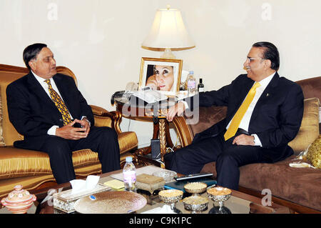 President, Asif Ali Zardari talks with Lt.Gen.(Retd) Moin-ud-Din Haider during meeting at Aiwan-e-Sadr in Islamabad on Monday, January  16, 2012. Stock Photo