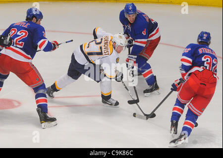 Jan. 17, 2012 - New York, New York, U.S - New York Rangers defenseman Michael Del Zotto (4) and defenseman Anton Stralman (32) defend Nashville Predators right wing Patric Hornqvist (27) during third period NHL action between the New York Rangers and the Nashville Predators at Madison Square Garden  Stock Photo