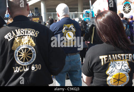 Members of the Teamsters holds  a sign in support of workers at American Reclamation. Community leaders and labor groups gathered for a rally outside a waste and recycling facility operated by American Reclamation in Los Angeles, CA January 19, 2012. The facility has come under investigation followi Stock Photo