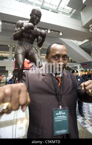 Jan. 20, 2012 - Detroit, Michigan, U.S - Legendary boxer Tommy ''The Hitman'' Hearns stands beneath a statue of Joe Louis inside Cobo Hall during the auto show in Detroit, MI on Jan 20, 2012. (Credit Image: © Mark Bialek/ZUMAPRESS.com) Stock Photo