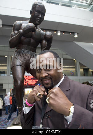 Jan. 20, 2012 - Detroit, Michigan, U.S - Legendary boxer Tommy ''The Hitman'' Hearns stands beneath a statue of Joe Louis inside Cobo Hall during the auto show in Detroit, MI on Jan 20, 2012. (Credit Image: © Mark Bialek/ZUMAPRESS.com) Stock Photo