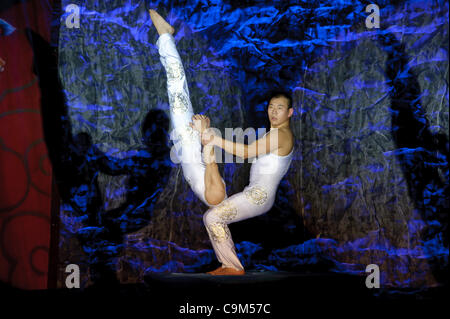 LINCOLN, CA - January 20: The Chinese Acrobats Of Hebei perform strong man at Thunder valley Casino in Lincoln, California on January 20, 2012 Stock Photo