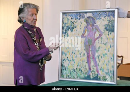 Czech benefactor Meda Mladkova unwrapped painting A girl dancing in the garden from famous Czech artist Frantisek Kupka. Meda Mladkova has bought 44 Kupka's paintings in the U.S. from American historian Lilli Lonngren Anders. All the artworks will be exposed in Kampa museum in Prague, Czech Republic Stock Photo