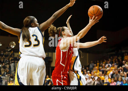 Jan. 25, 2012 - Toledo, Ohio, U.S - Miami (OH) guard Courtney Osborn (10) puts up a shot between Toledo guard Andola Dortch (22) and center Yolanda Richardson (33) during first-half game action.  The Toledo Rockets, of the Mid-American Conference West Division, defeated the Miami RedHawks, of the MA Stock Photo