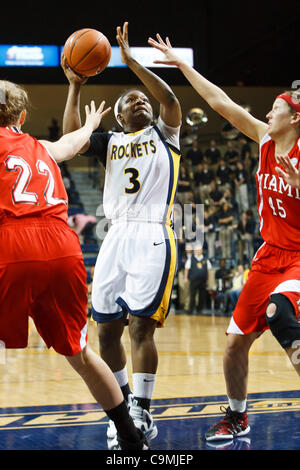 Jan. 25, 2012 - Toledo, Ohio, U.S - Toledo guard Lecretia Smith shoots over Miami (OH) forwards Kirsten Olowinski (45) and Kristin Judson (22) during second-half game action.  The Toledo Rockets, of the Mid-American Conference West Division, defeated the Miami RedHawks, of the MAC East Division, 79- Stock Photo