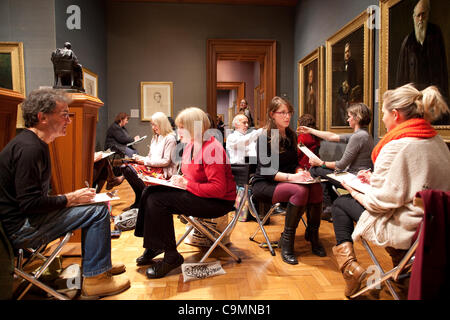 National Portrait Gallery, London. 26.01.2012 Picture shows couples sat sketching one another at the 'Come Draw With Me' arts educational charity event at the National Portrait Gallery which promotes drawing and encourages people to draw at home with friends and neighbours, the Campaign's mission is Stock Photo
