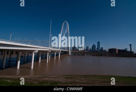 Jan. 26, 2012 - Dallas, Texas, USA - January 26, 2012. Dallas, Tx. USA. After heavy rains the flooded Trinity River runs underneath the soon to be opened Margaret Hunt Hill Bridge which connects Singleton Boulevard with the Woodall Rogers Freeway in West Dallas. The 40 story arch costing 117 million Stock Photo