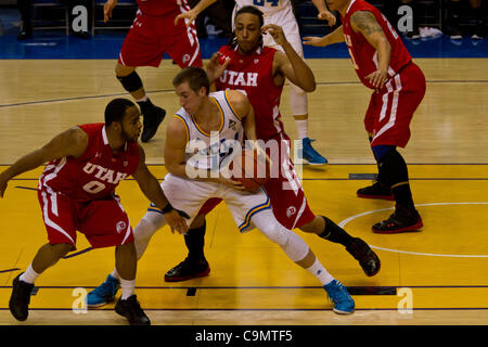 Jan. 26, 2012 - Los Angeles, California, U.S - UCLA Bruins David Wear (12) tries to drive past Utah Utes Chris Hines (0) and Dijon Farr (10) in first half action.  The UCLA Bruins lead the Utah Utes 36-21 at the half. (Credit Image: © Josh Chapel/Southcreek/ZUMAPRESS.com) Stock Photo