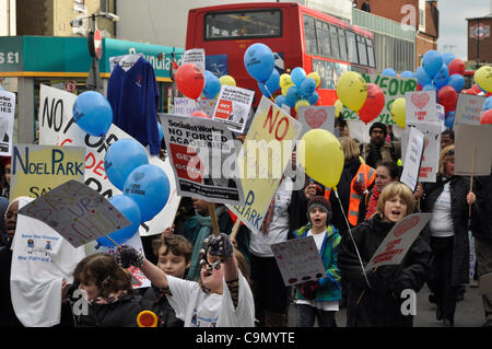 28/01/2012 Haringey, London UK. Enthusiastic young students lead parents and teachers in a protest against plans to turn Downhills primary school Tottenham into a sponsored academy. Stock Photo