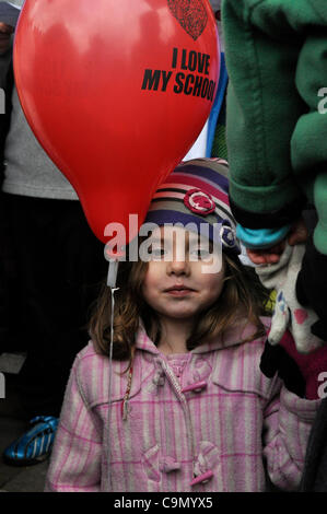 28/01/2012 Haringey, London UK. A young girl holds her mums hand as she protests on the steps of Haringey Civic Centre against plans to turn Downhills primary school Tottenham into a sponsored academy. Stock Photo