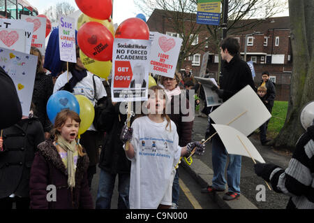 28/01/2012 Haringey, London UK. Young students lead the way during a protest against plans to turn Downhills primary school Tottenham into a sponsored academy. Stock Photo