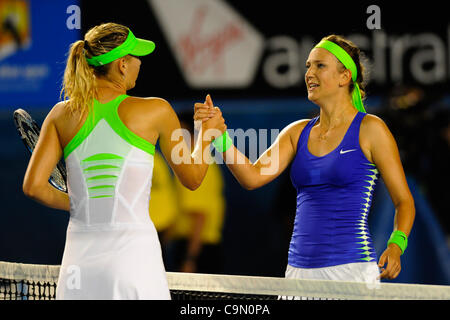 28.01.2012 Australian Open Tennis from Melbourne Park. Victoria. Womens Finals match.  Azarenka (BLR) is congratulated by Maria Sharapova (RUS) after the former had won her match on the thirteenth day of the Australian Open Tennis Championships in Melbourne, Australia. Victoria Azarenka beat Maria S Stock Photo