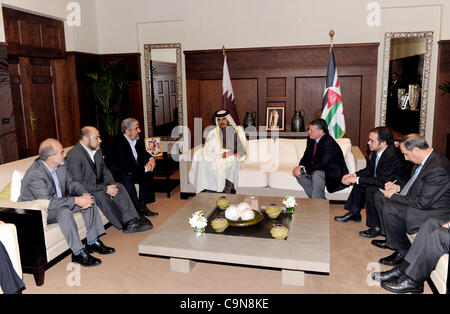 Jan. 29, 2012 - Amman, Amman, Jordan - Crown Prince of Qatar Sheikh Tamim bin Hamad, center, speaks to Hamas leader Khaled Mashaal, left, and King Abdullah II of Jordan, right, in Amman, Jordan, Sunday, Jan. Jan. 29, 2012.A high-profile visit to Jordan by the leader of Hamas has revived contacts wit Stock Photo