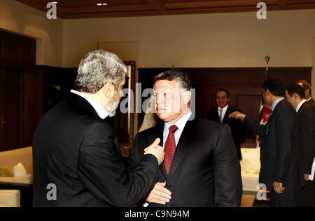 Jan. 29, 2012 - Amman, Jordan - Jordan's King ABDULLAH II (R) chats with senior Hamas leader KHALED MESHAAL on his arrival at the Royal Palace in Amman. Meshaal on Sunday made his first official visit to Jordan since the kingdom expelled him more than a decade ago and held talks with King Abdullah.  Stock Photo