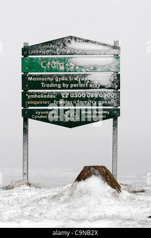 Snow splattered sign for Craig-y-Llyn on top of the Rhigos Mountain road in the South Wales Valleys after a significant snowfall. Stock Photo