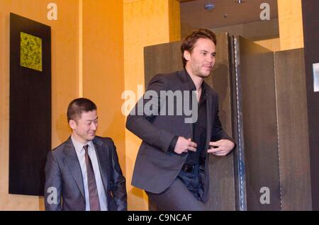 Tadanobu Asano and Taylor Kitsch, Jan 31, 2012 : Tokyo, Japan, Taylor Kitsch and Japanese actor Tadanobu Asano appear at a press conference for the film 'BATTLESHIP' by Peter Berg in the Grand Hyatt Tokyo. This film is about the battle against the aliens and a love story. Taylor Kitsch, Alexander Sk Stock Photo