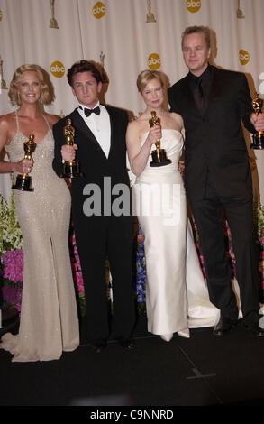 Feb 29, 2004; Hollywood, CA, USA; OSCARS 2004: Actress CHARLIZE THERON winner for best actress in 'Monster' SEAN PENN winner for best actor in 'Mystic River' with RENEE ZELLWEGER winner for best supporting actress in 'Cold Mountain' and TIM ROBBINS in the press room at the 76th Annual Academy Awards Stock Photo