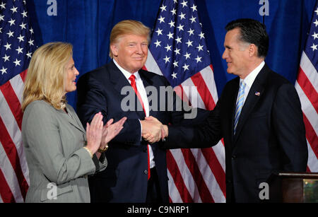 Feb. 2, 2012 - Las Vegas, Nevada, USA -  Republican presidential candidate, former Massachusetts Gov. MITT ROMNEY (R) and DONALD TRUMP (R) shake hands during a news conference held by Trump to endorse Romney for president as Romney's wife ANN ROMNEY looks on at the Trump International Hotel & Tower  Stock Photo