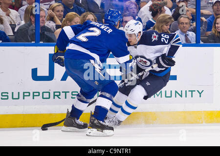Feb. 2, 2012 - Tampa, Florida, United States of America - Feb. 2, 2012 - Tampa, Florida, United States of America Tampa Bay Lightning defenseman Eric Brewer (2) and Winnipeg Jets right wing Blake Wheeler (26) scuffle for the puck during the second period of the game between the Tampa Bay Lightning a Stock Photo