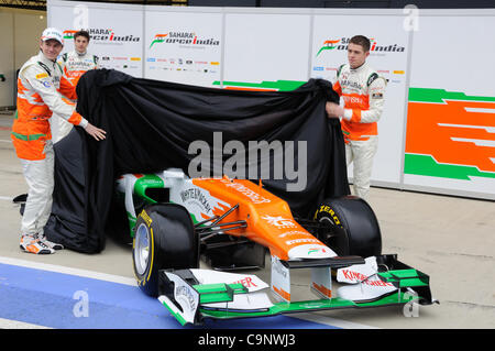 Silverstone, UK. 3rd Feb, 2012. Drivers Nico Hulkenberg (left), Jules Bianchi (back) and Paul di Resta (right) reveal the new Force India 2012 car, the VJM05, at Silverstone Stock Photo
