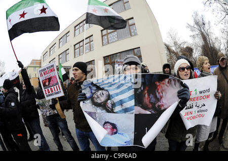 Anti-Syrian regime protesters call for Syrian President Bashar Assad to step down outside the Syrian Embassy in Prague, Sunday, Feb. 5, 2012. (CTK Photo/Vit Simanek) Stock Photo