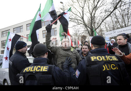 Anti-Syrian regime protesters call for Syrian President Bashar Assad to step down outside the Syrian Embassy in Prague, Sunday, Feb. 5, 2012. (CTK Photo/Vit Simanek) Stock Photo