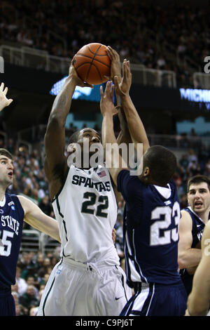 Michigan State guard Branden Dawson, left, shoots over Sandi Marcius in ...