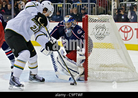 Feb. 9, 2012 - Columbus, Ohio, U.S - Dallas Stars left wing Loui Eriksson (21) pulls the puck away from the post to attempt a shot on Columbus Blue Jackets goalie Curtis Sanford (30) during the third period of the game between the Dallas Stars and Columbus Blue Jackets at Nationwide Arena, Columbus, Stock Photo