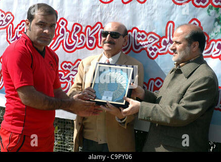 Balochistan Sports Minister, Mir Shahnawaz Khan Murree along with Iran Consul Gen, Syed Hassan Yehyavi awards prizes among football players during prize distribution ceremony of a football tournament arranged by Khana-e-Farhang Iran held in  Quetta on Friday, February 10, 2012 Stock Photo